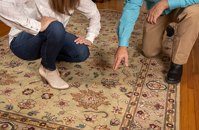 after cleaning rug, specialists are inspecting