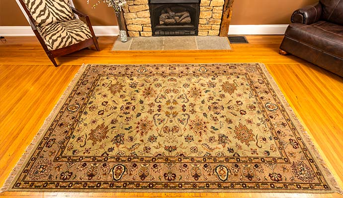 Clean protected oriental area rug on a hardwood floor