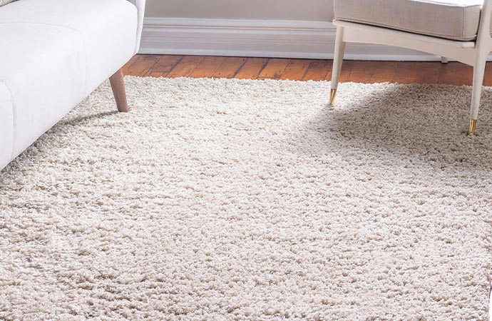 modern living area wood floor low pile rug