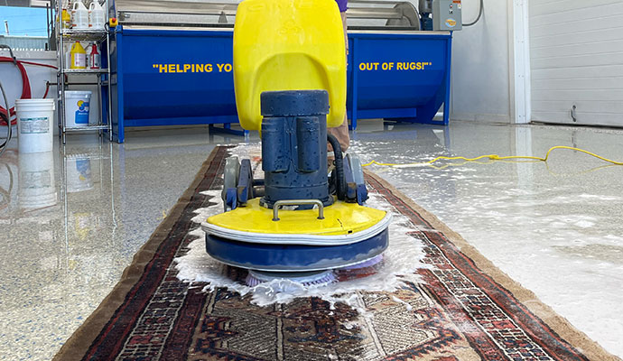 Rug cleaning with machine