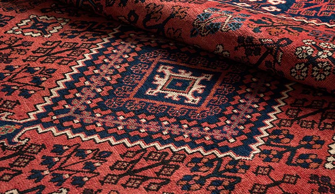Close up of traditional red and blue oriental rug