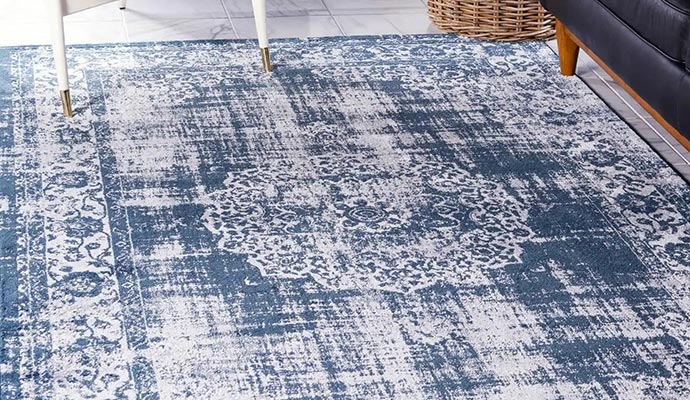 Soil and stain protected rug