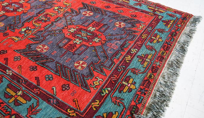 Red and teal turkish rug