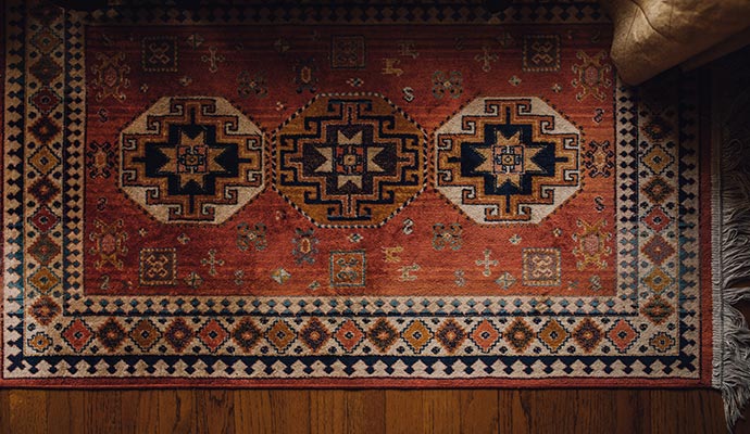 Smoke-damaged rug on floor