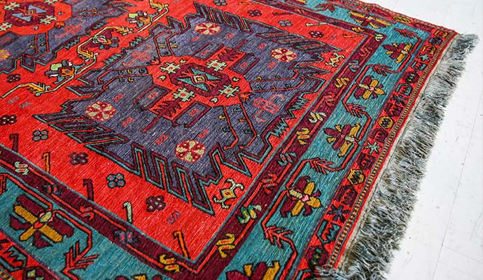 Traditional colorful Turkish wool rug with fringe