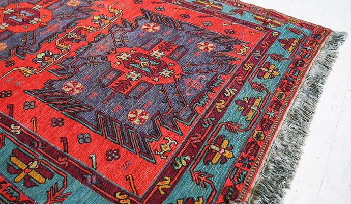 Traditional colorful oriental area rug with fringe